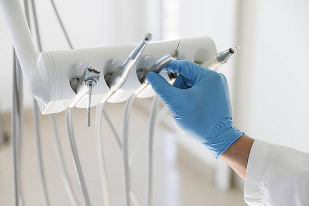 Professional Tooth Extraction technician working in South River, NM